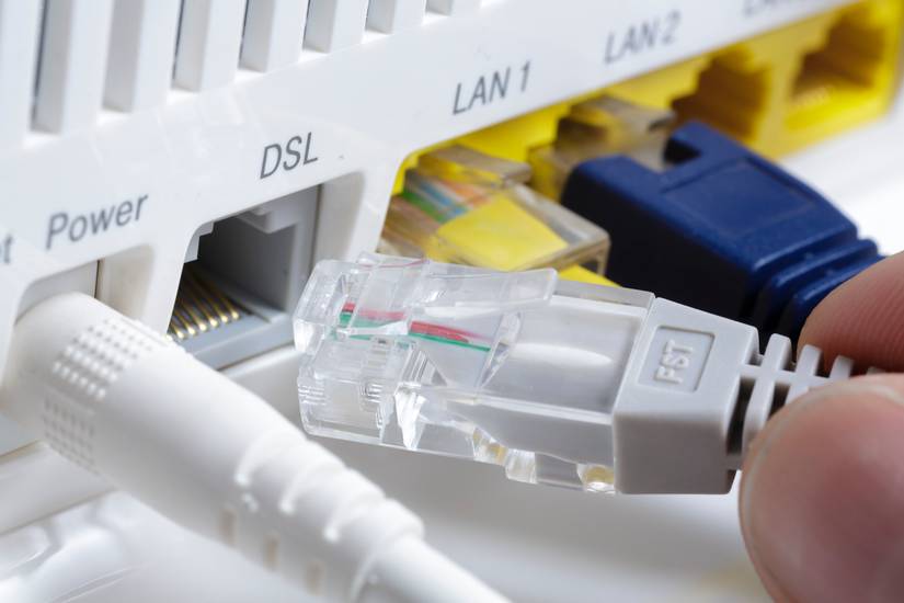 plugging a network cable into a DSL port on a router