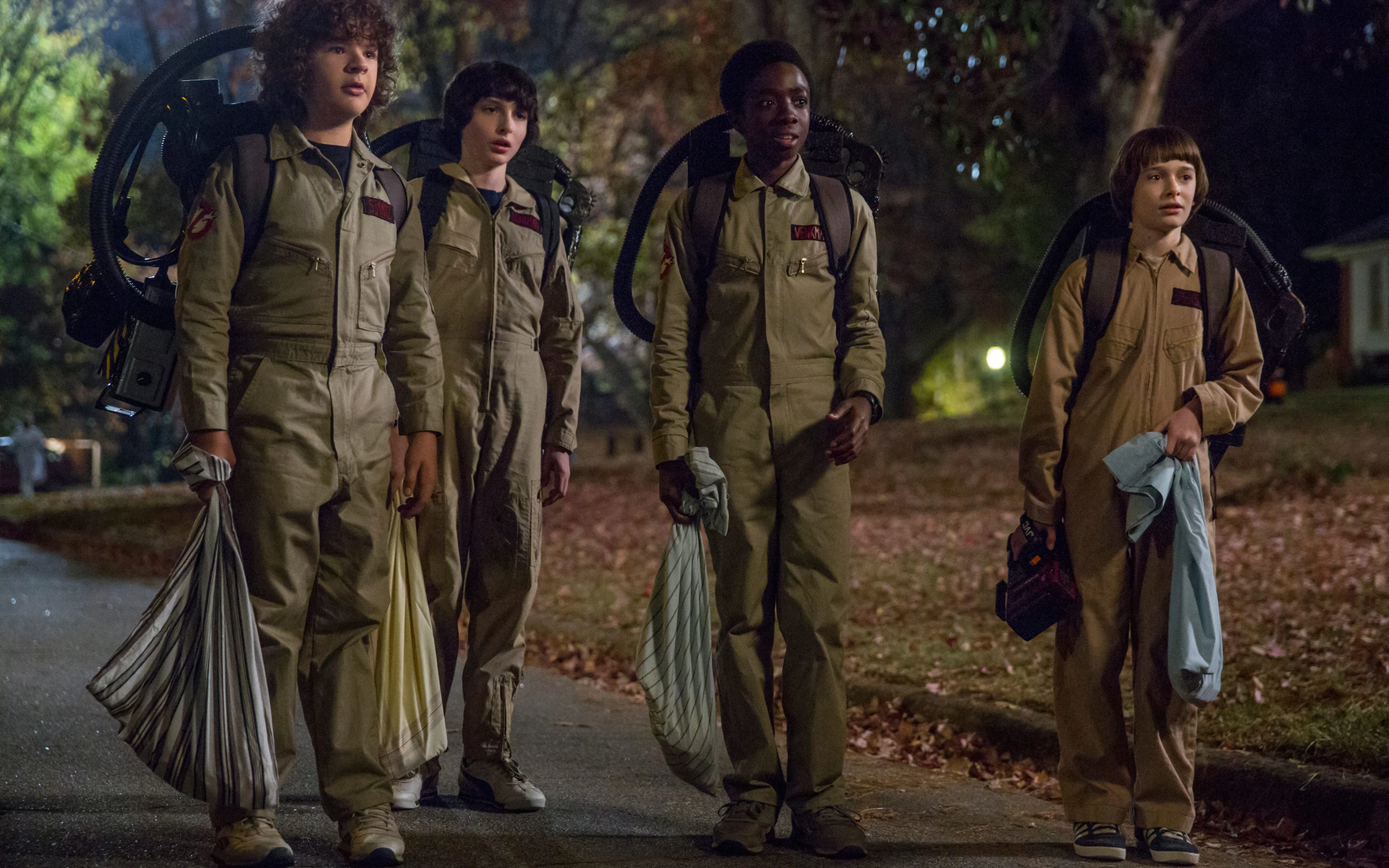 The Stranger Things gang dressed as the Ghostbusters gang
