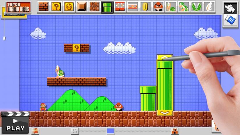 A screenshot of Super Mario Maker on Wii U with a hand holding a stylus