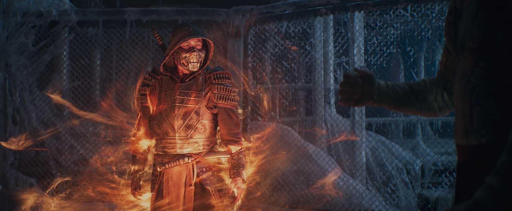 Scorpion stands in flames in an icy retreat in Mortal Kombat 2021
