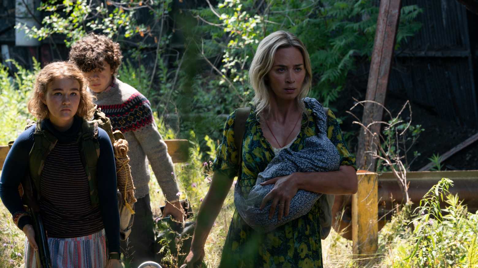 The Abbott family navigating the wilderness in A Quiet Place Part II