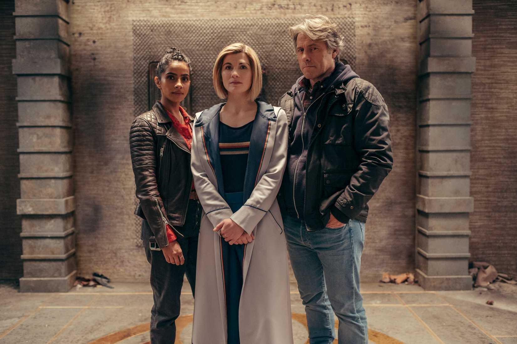 The Doctor (JODIE WHITTAKER) Yasmin Khan (MANDIP GILL), Dan (JOHN BISHOP) stand in an ancient ruin