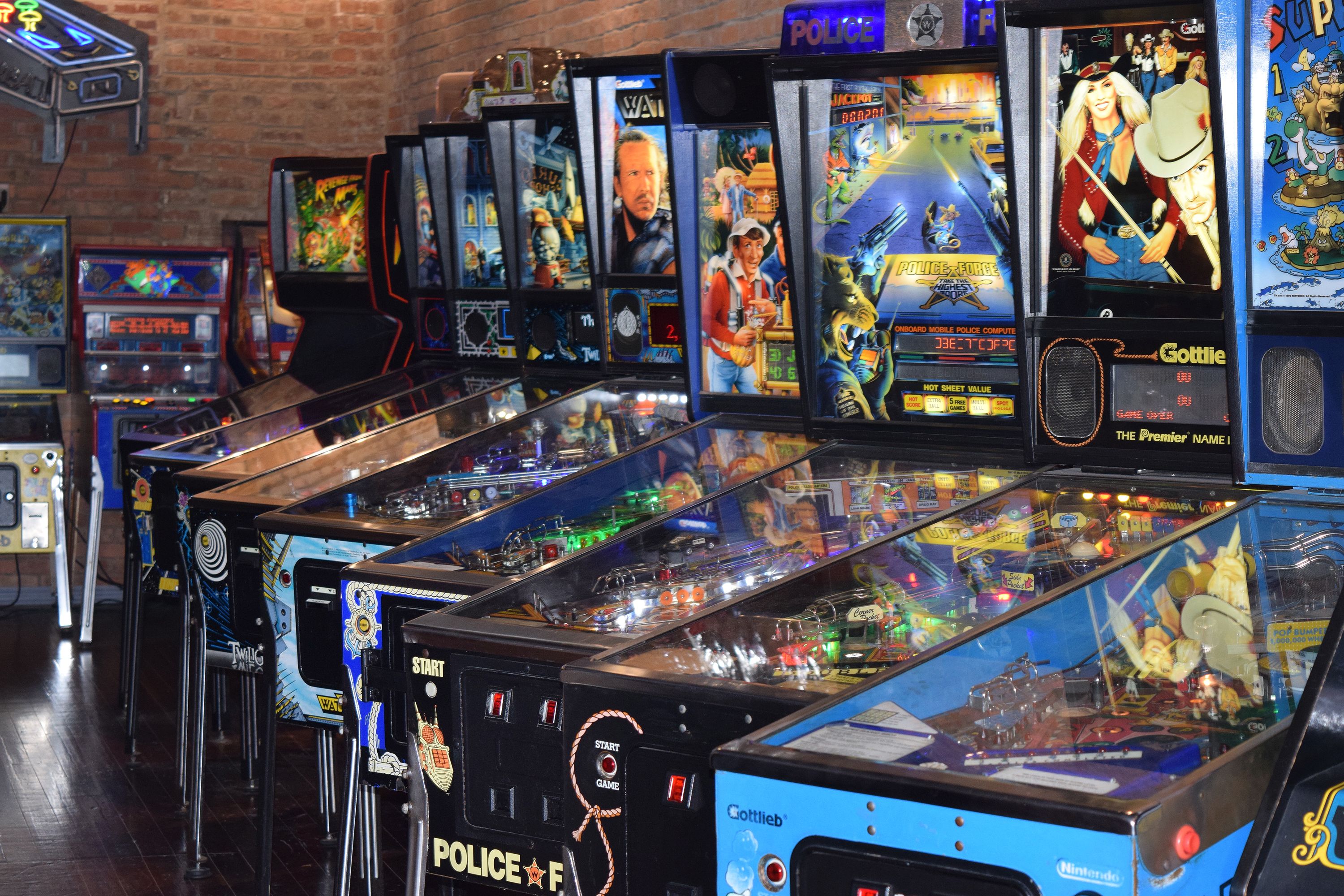 A row of classic pinball machines