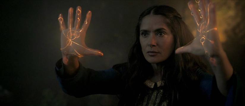 Ajak (Salma Hayek) using her glowing hands in Eternals
