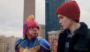 Ms. Marvel and her friend in a red beanie prepare to jump off a building