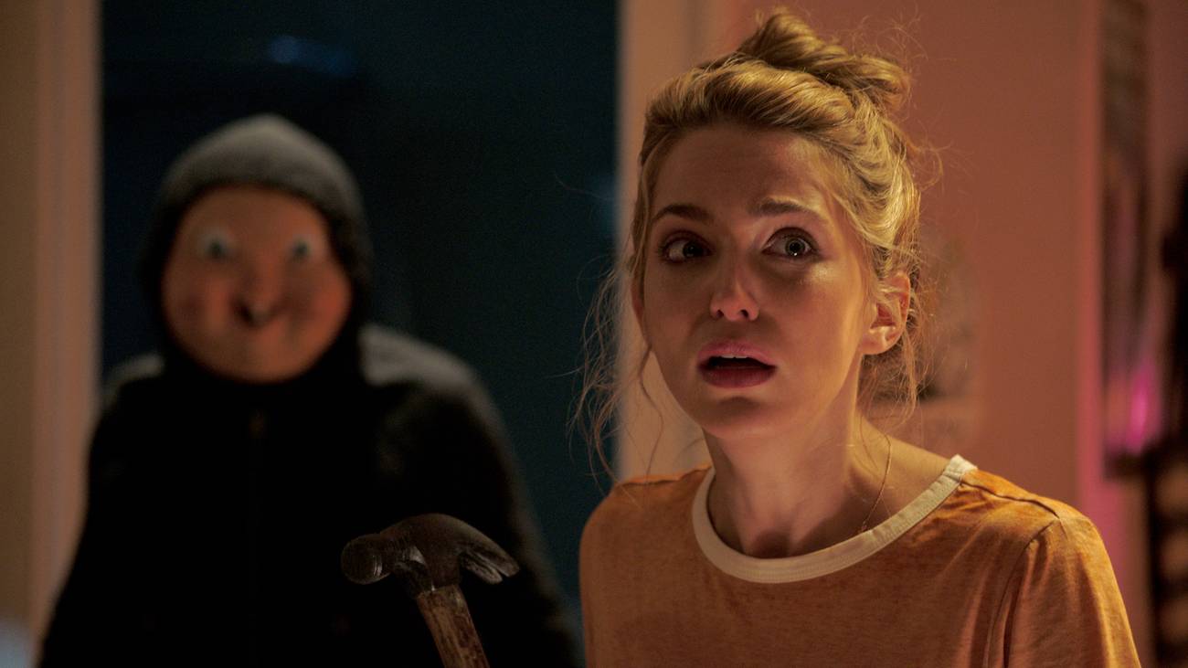 Jessica Rothe and the masked killer in Happy Death Day (2017)