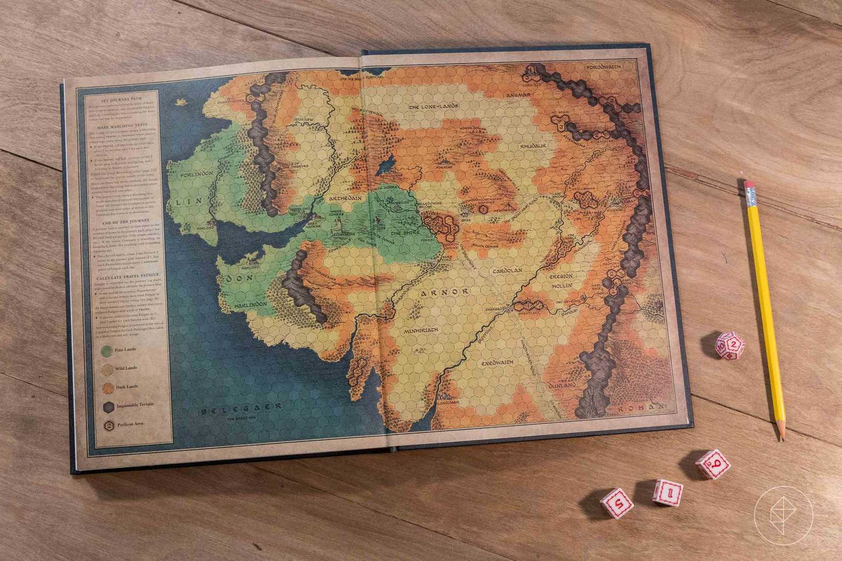 The rear flyleaf shows a similar map overlaid with a hex to mediate overland travel.