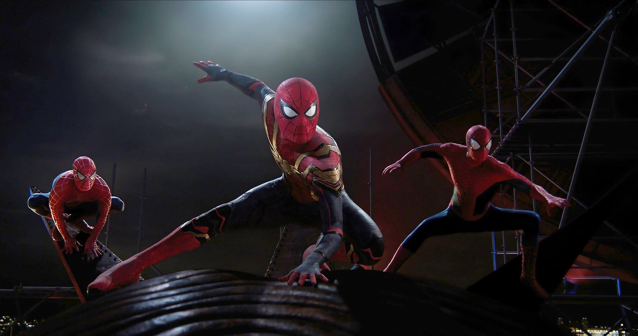 Tobey Maguire, Tom Holland, and Andrew Garfield standing together