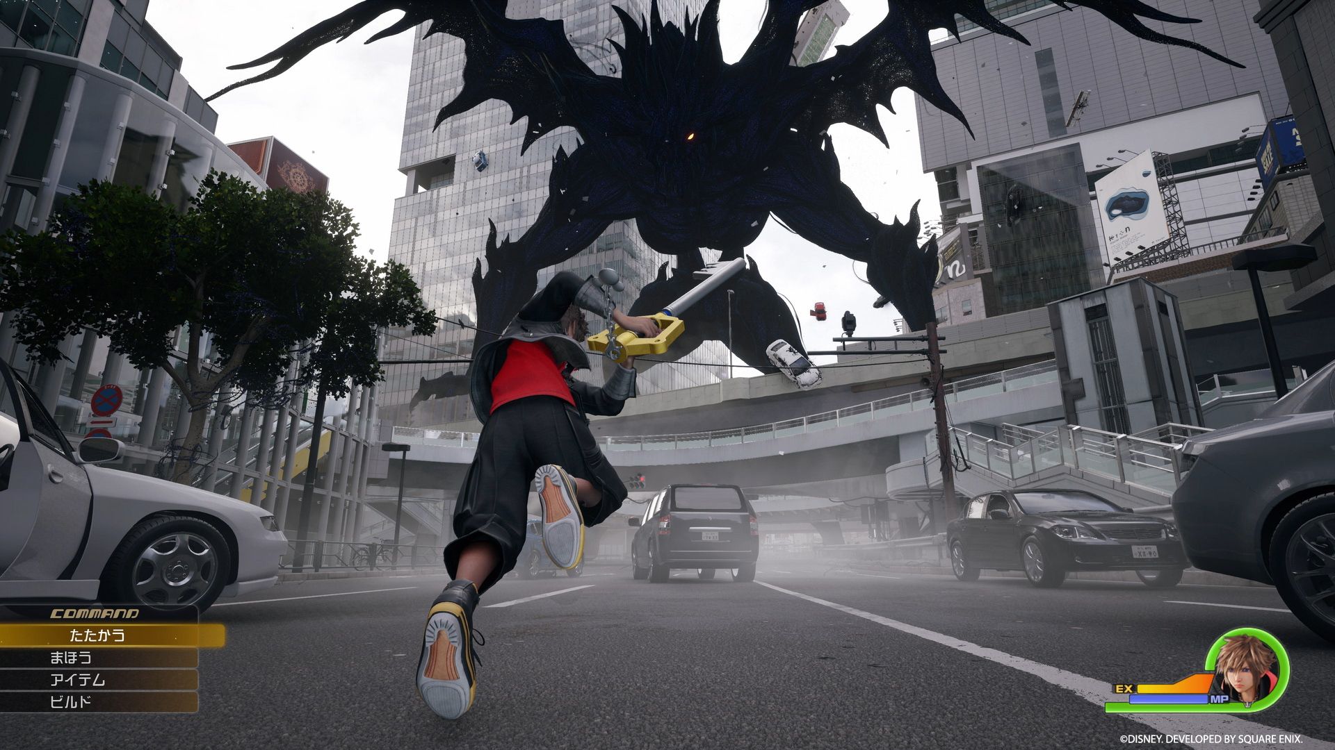 Sora battles a giant Heartless on the streets of Shibuya (aka Quadratum) in Kingdom Hearts 4