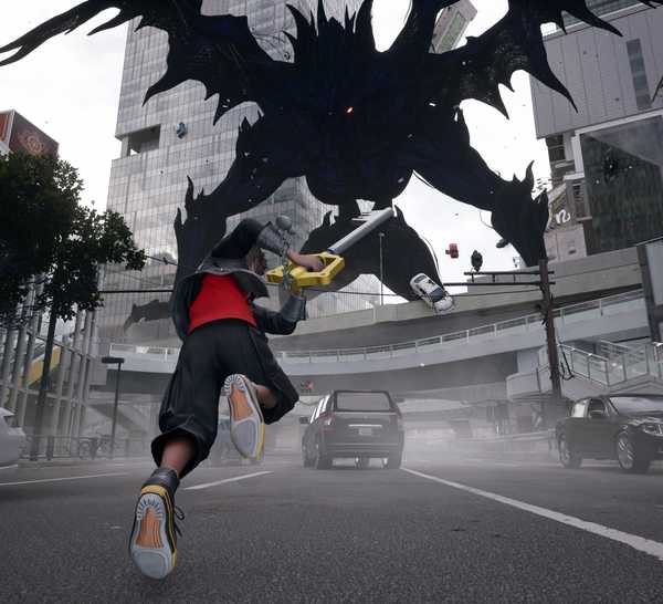 Sora battles a giant Heartless on the streets of Shibuya (aka Quadratum) in Kingdom Hearts 4