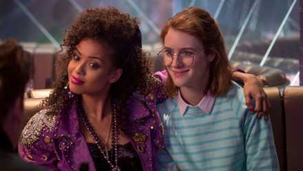 Kelly (Gugu Mbatha-Raw) and Yorkie (Mackenzie Davis) sit together in a virtual bar in the “San Junipero” episode of Black Mirror