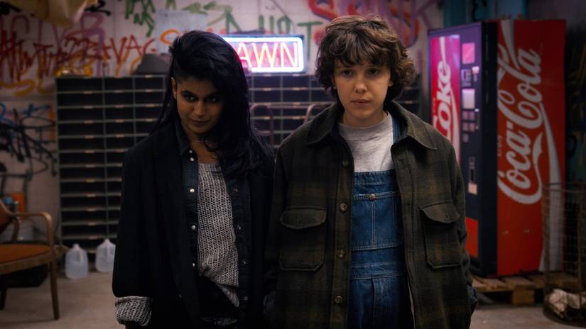 Kali and Eleven in a graffiti‑covered loft