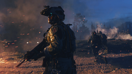 A soldier in Call of Duty: Modern Warfare 2 (2022) standing in front of a burning car