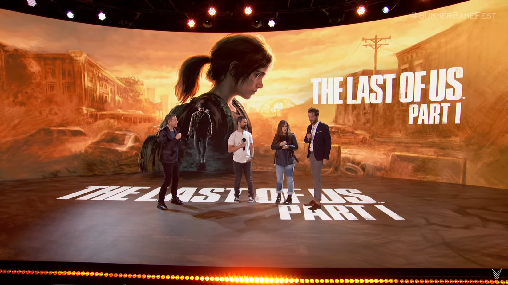 Geoff Keighley stands with Neil Druckmann, Ashley Johnson, and Troy Baker on the Summer Game Fest stage for a segment about The Last of Us Part I.