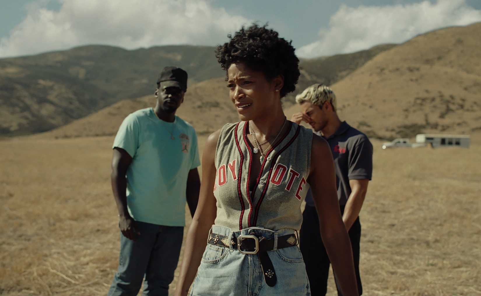 OJ Haywood (Daniel Kaluuya), Emerald Haywood (Keke Palmer), and Angel Torres (Brandon Perea) standing in a parched field in Nope