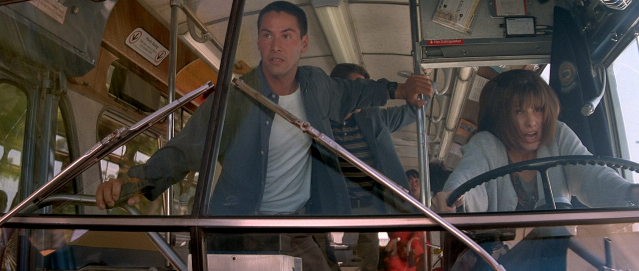 Keanu Reeves and Sandra Bullock on the bus in Speed.