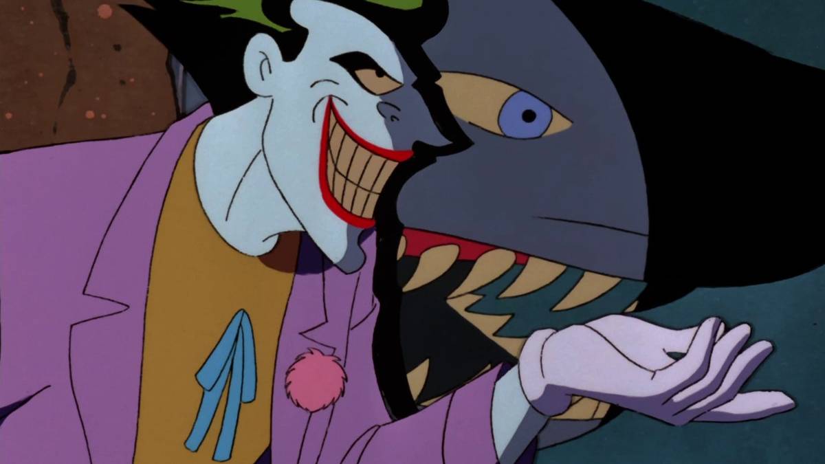 Joker standing beside a shark in a tank in “The Laughing Fish” from Batman: The Animated Series