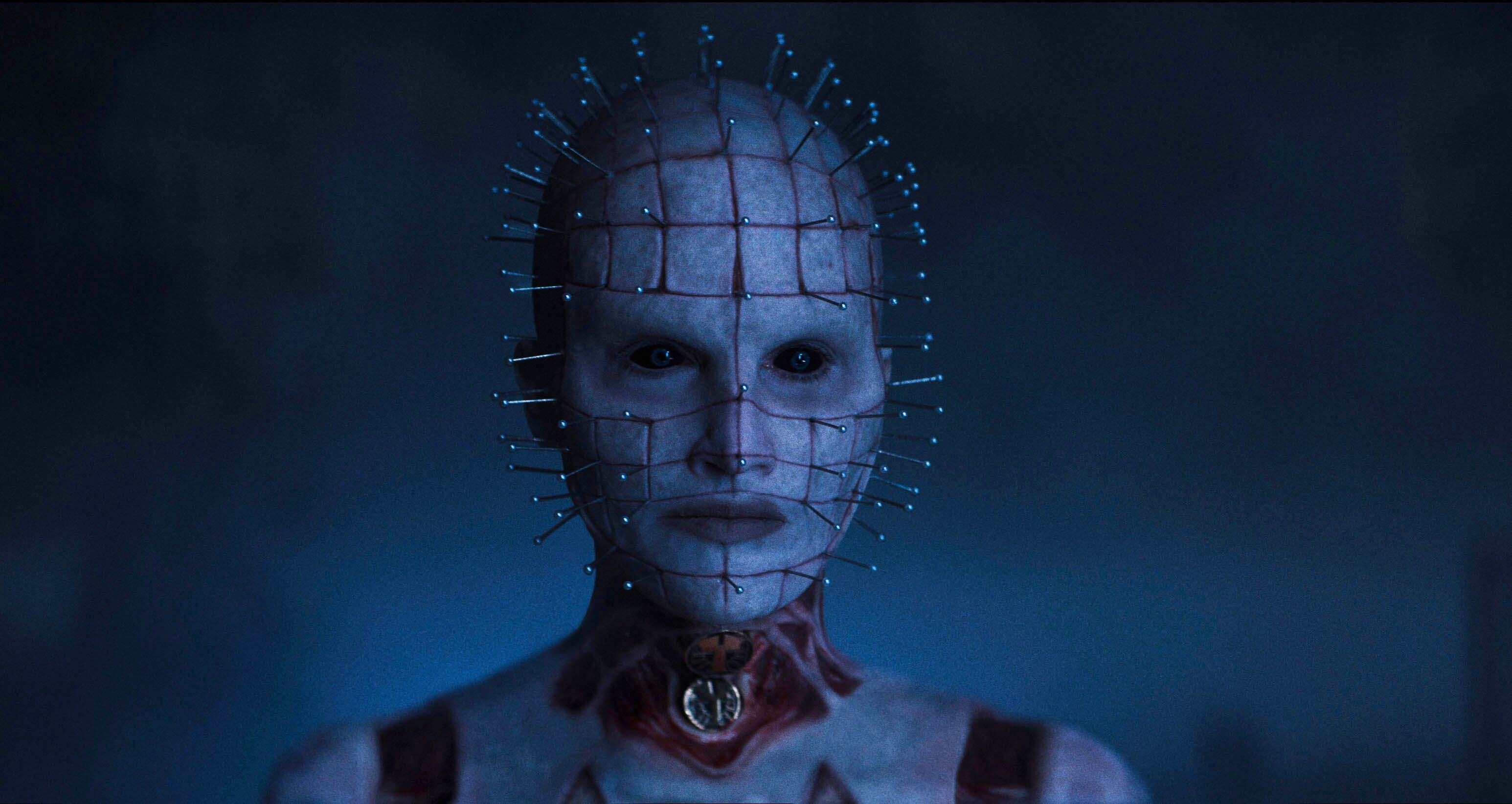 Jamie Clayton has pins in her head and a flayed neck in full Pinhead get-up.