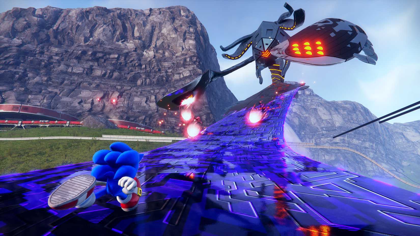 A screenshot from Sonic Frontier shows Sonic the Hedgehog running up the sleek limbs of a giant one-eyed metal creature called a Titan in an open-world area surrounded by mountain ridges.