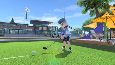 A Nintendo Switch Sports character tees up in a game of golf under a sunny blue sky