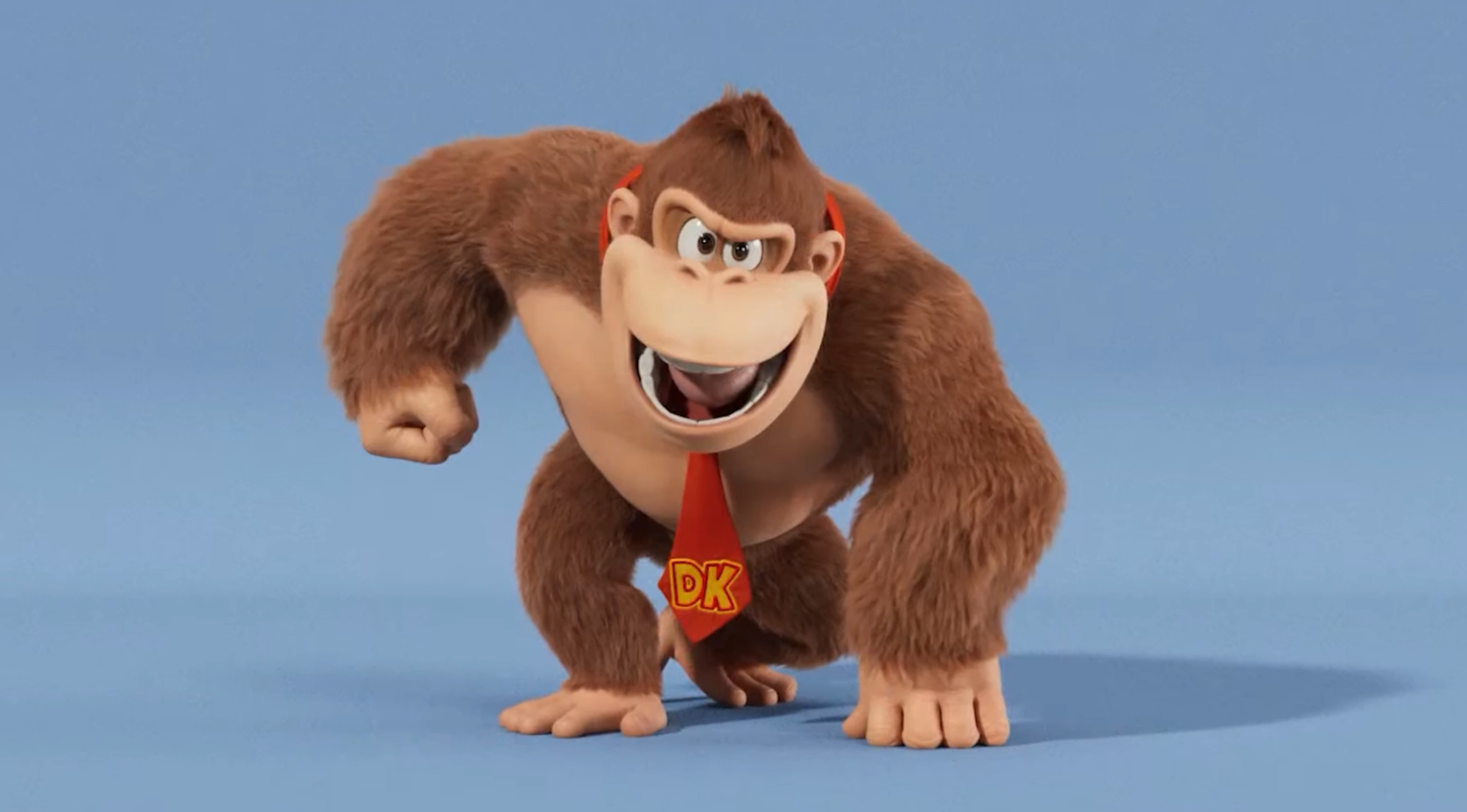 Donkey Kong as he appears in The Super Mario Bros. Movie. He looks like Donkey Kong normally does, with a red necktie — but his face is narrower and more mischievous. Perhaps...evil