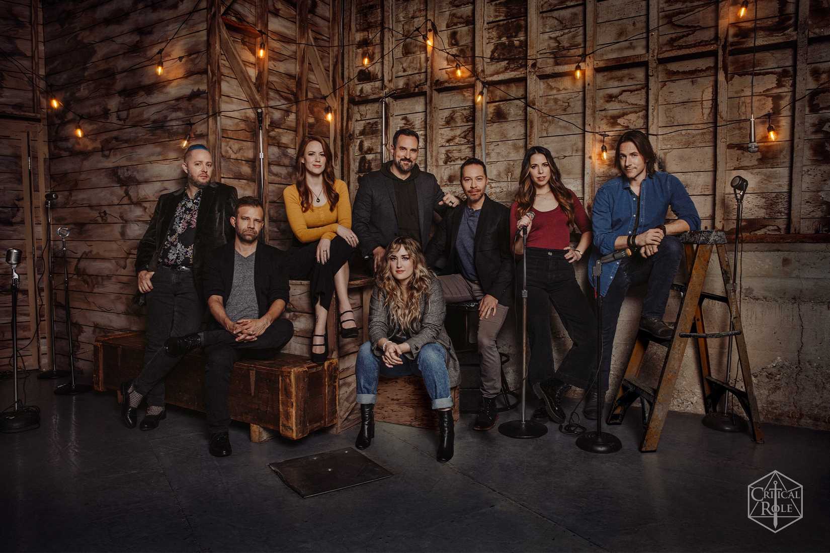 The ensemble cast of Critical Role posing for a professional group portrait.
