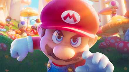 Mario lunges toward the camera in a field of mushrooms in a poster from The Super Mario Bros. Movie