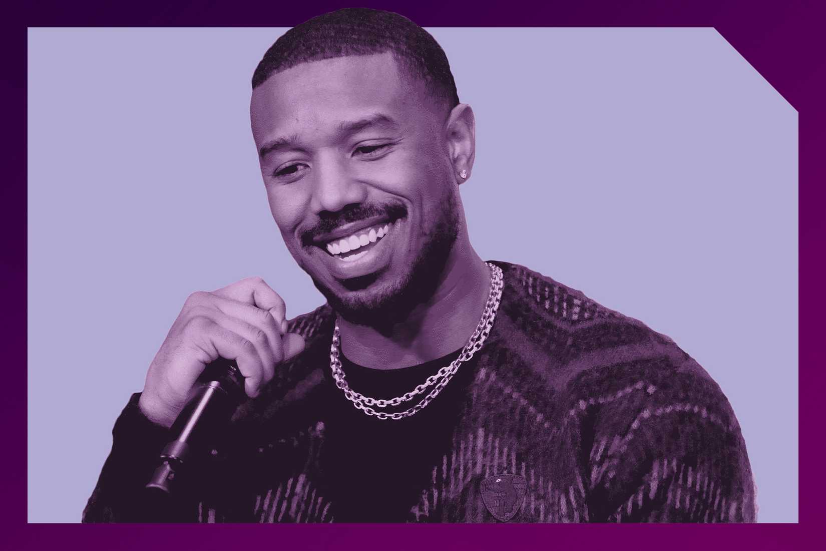 Michael B Jordan holding a microphone and smiling, while hued purple and set in a frame