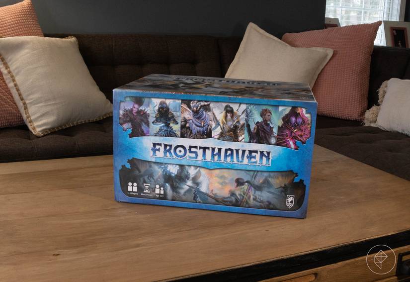 The Frosthaven box by itself sitting on a coffee table.