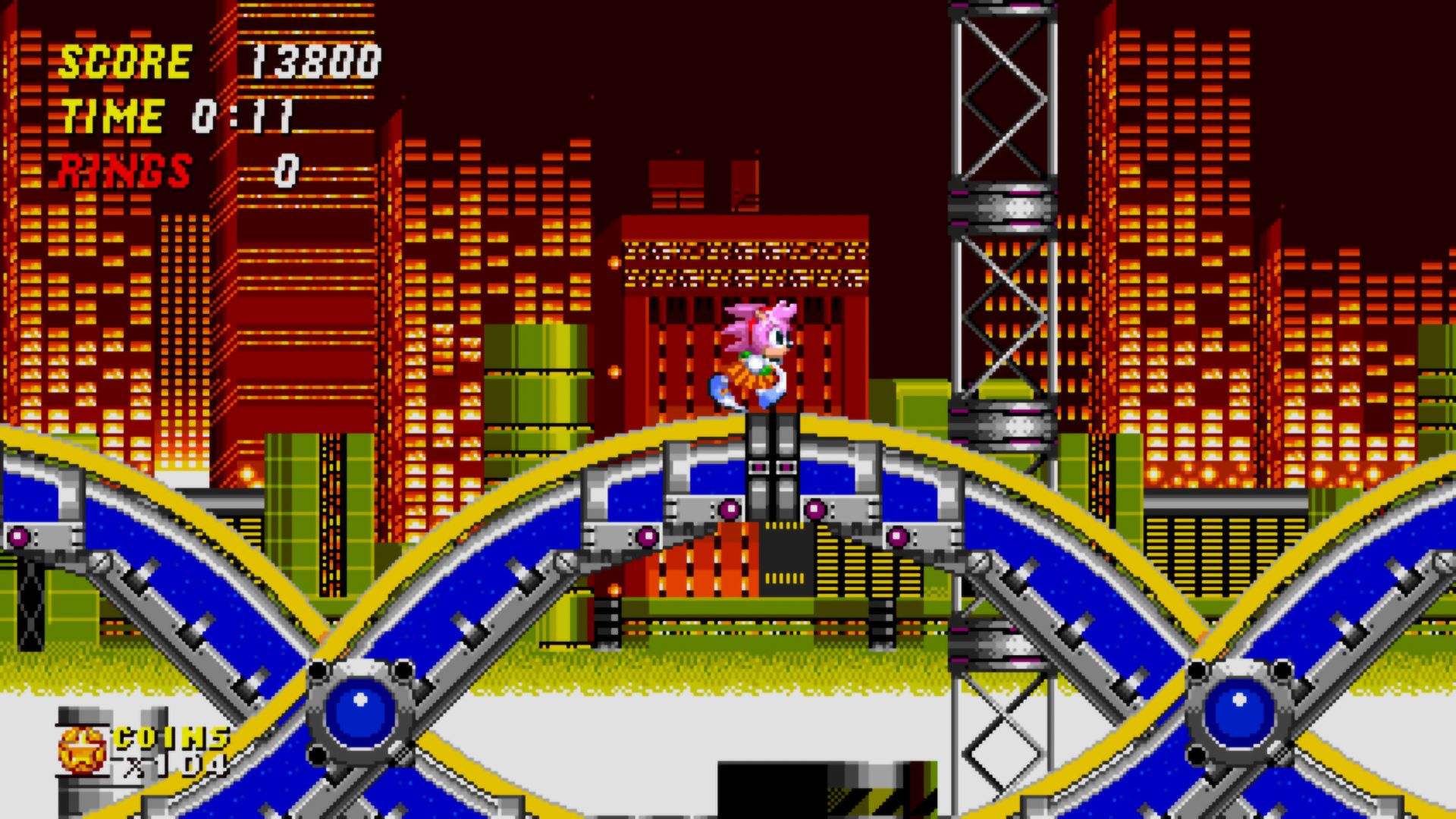 Amy Rose races through a classic Sonic the Hedgehog level in a screenshot from Sonic Origins Plus