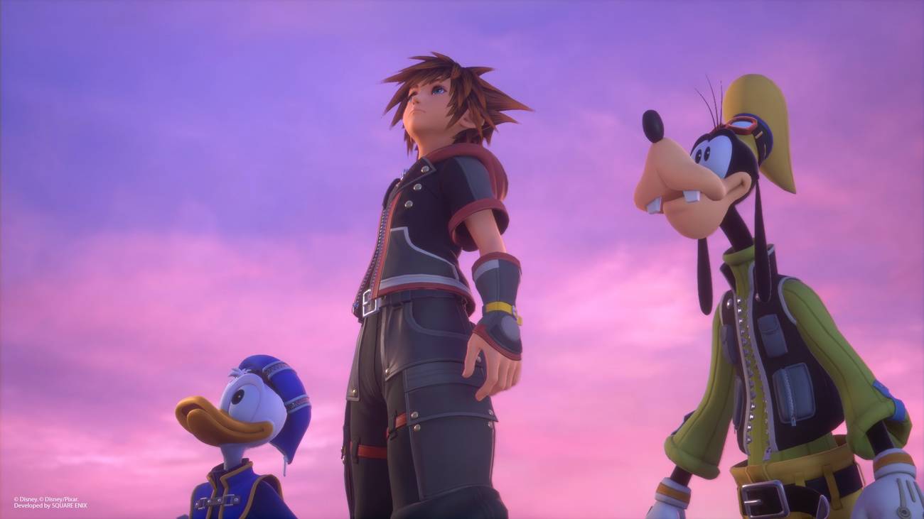 Donal Duck, Sora, and Goofy stand together, underneath a pinkish and purple sky. They are looking up and to the left.
