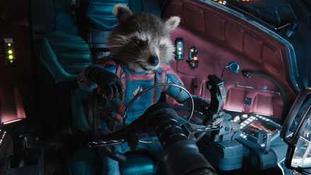 Anthropomorphic raccoon Rocket sits in the cockpit of a spaceship