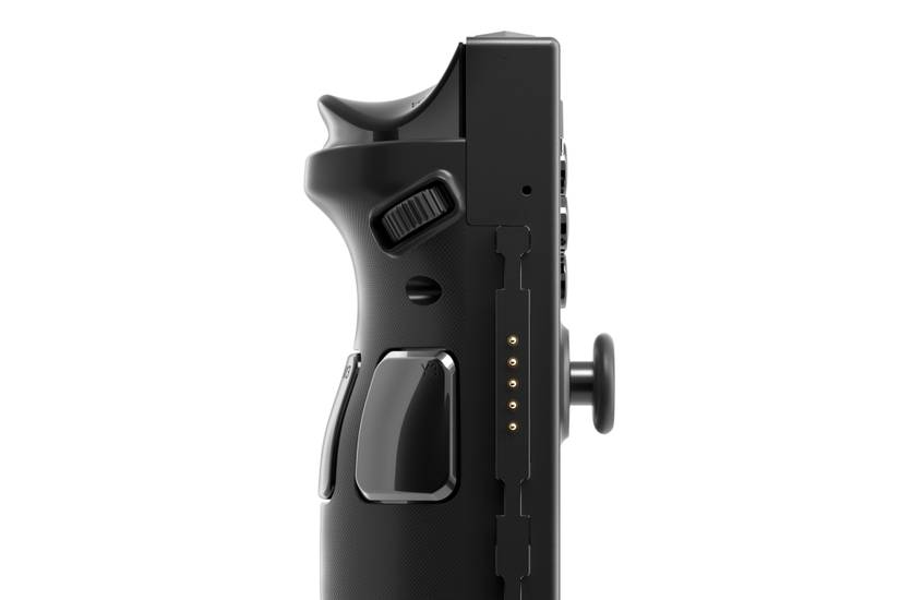 A close-up shot of the side of the right detachable controller. The image is zoomed in on the controller’s mouse scroll wheel, its analog stick, shoulder buttons, and customizable macro buttons.