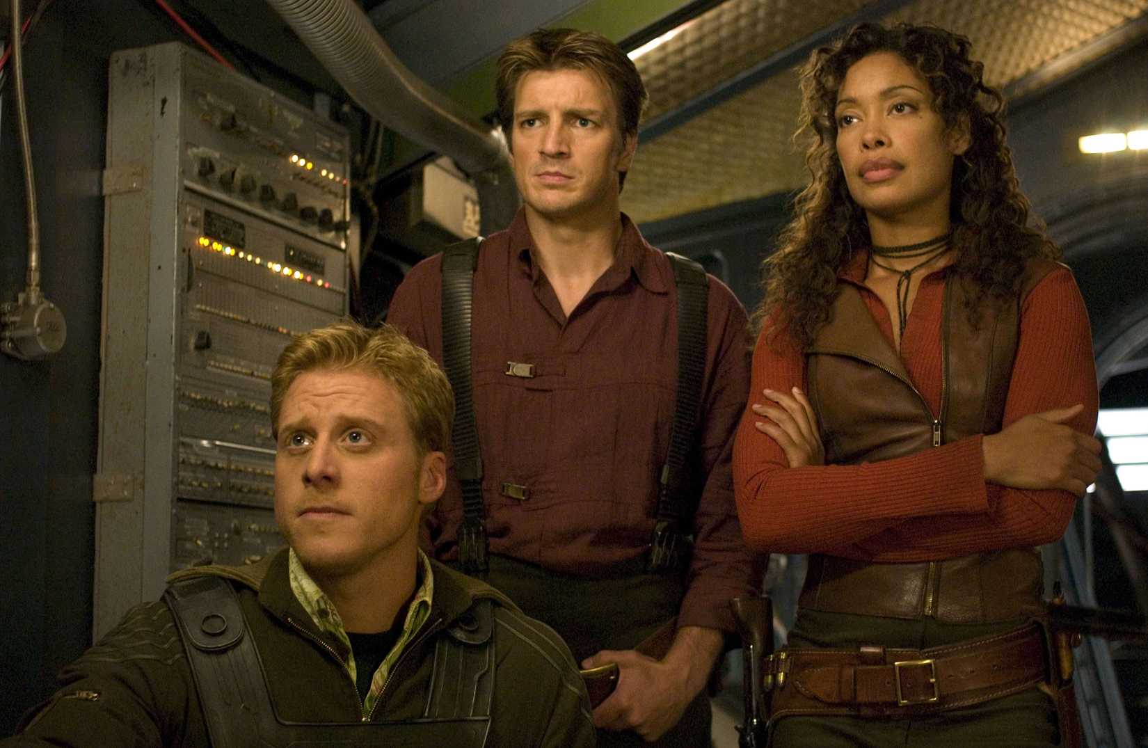 (L-R) Alan Tudyk, Nathan Fillion, and Gina Torres in Serenity.
