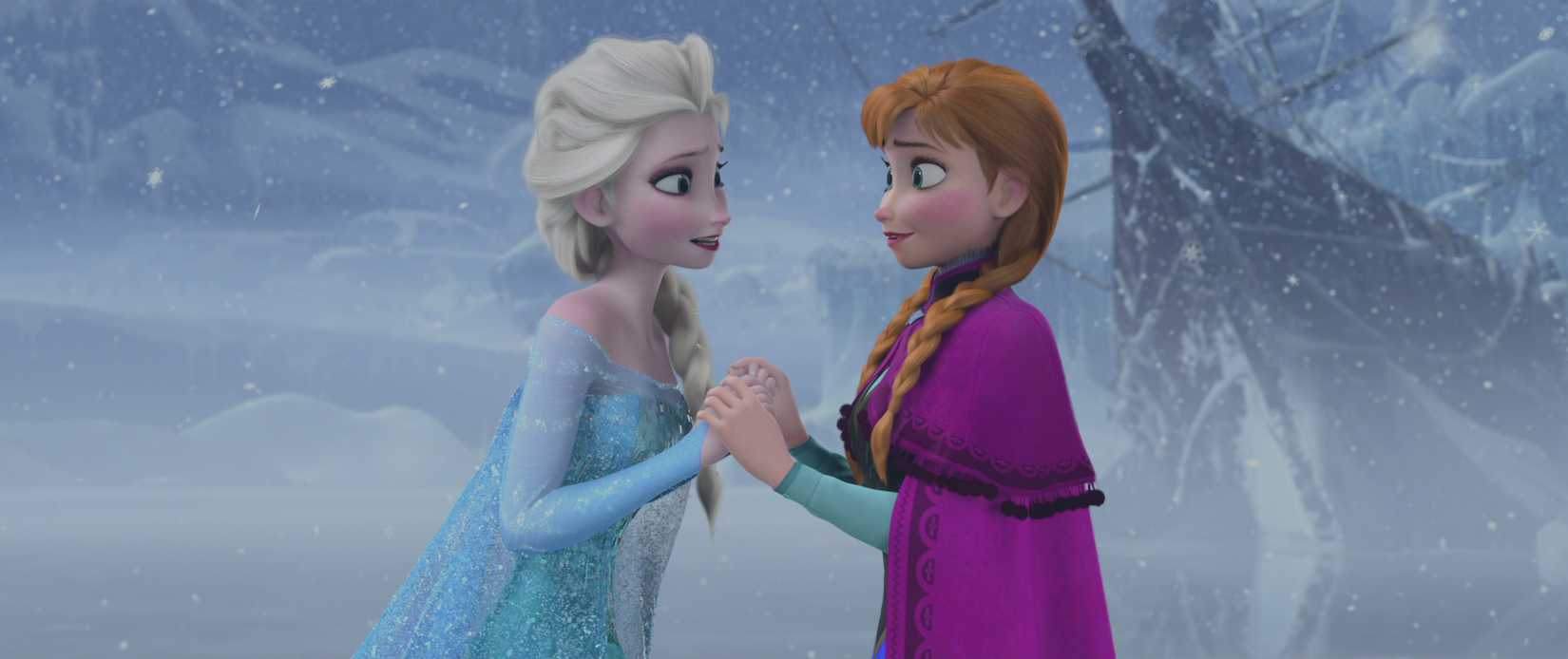Anna and Elsa holding hands at the end of Frozen, after Anna’s act of true love saves the day