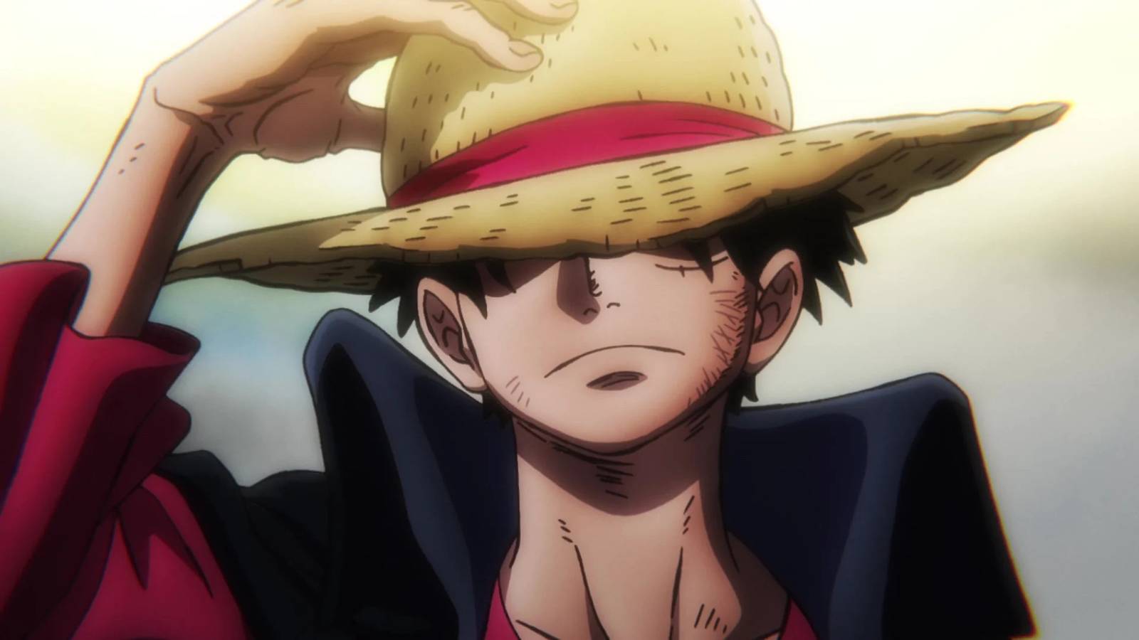 Luffy standing and adjusting his hat in the One Piece anime