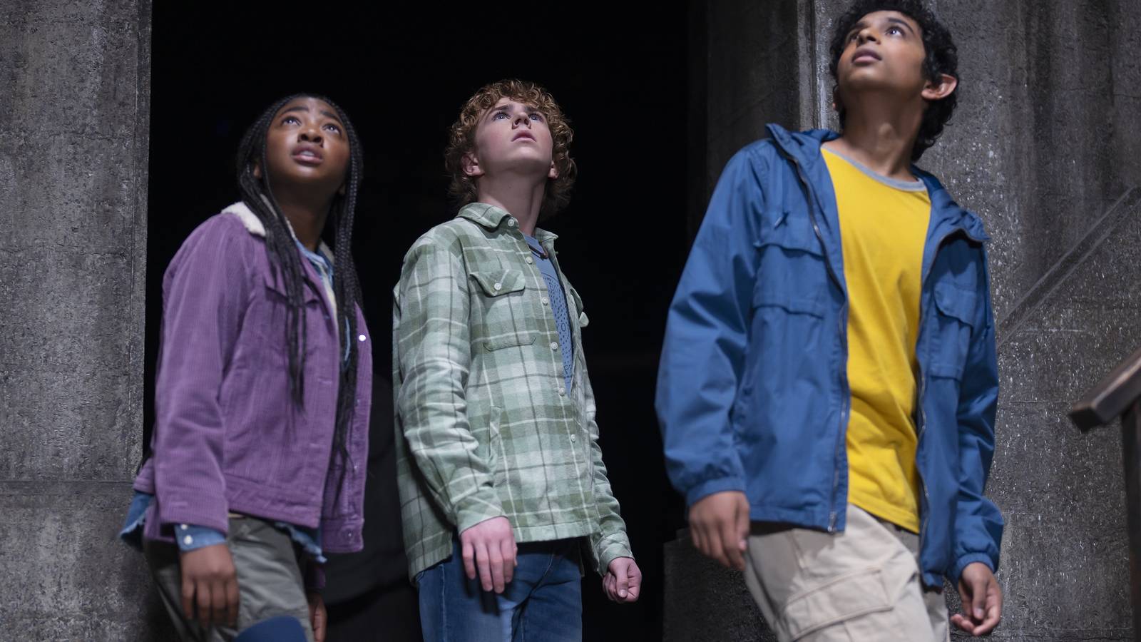 Annabeth, Percy, and Grover looking up at something in a still from Percy Jackson and the Olympians
