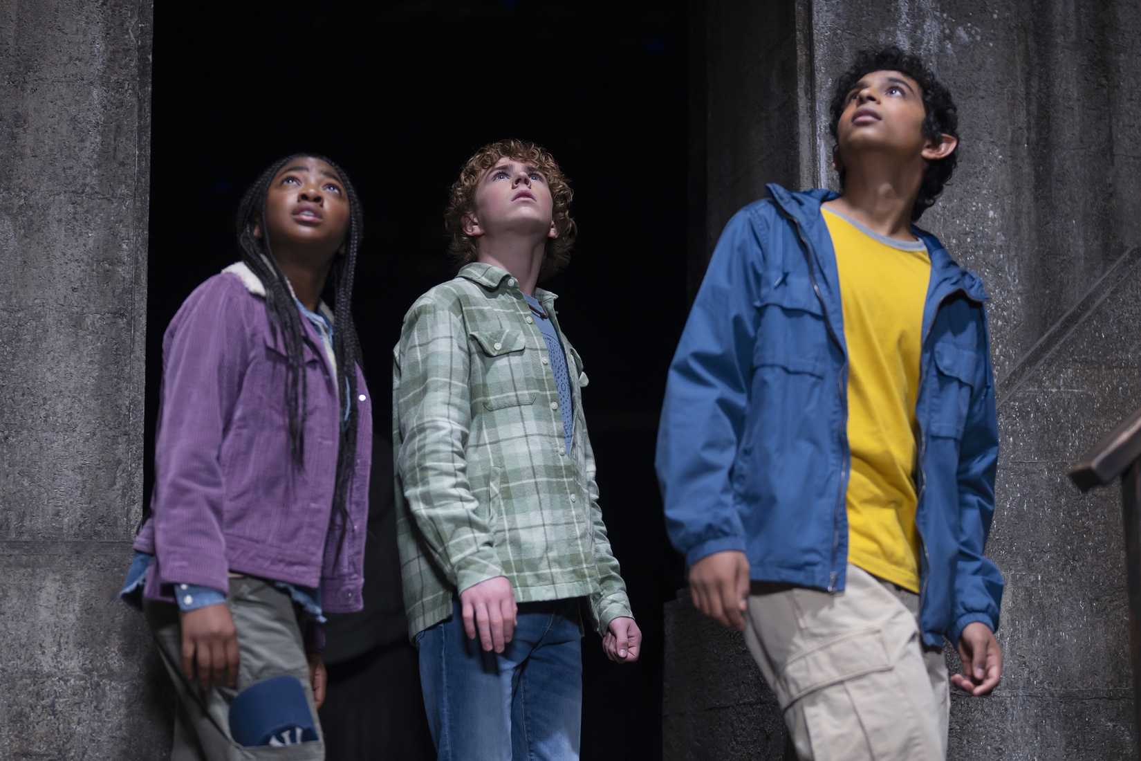 Annabeth, Percy, and Grover looking up at something in a still from Percy Jackson and the Olympians
