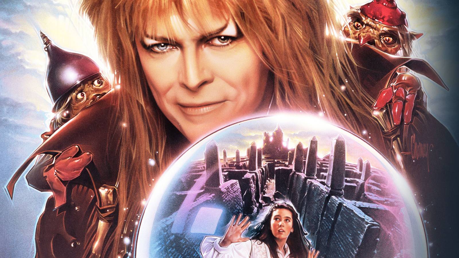 David Bowie’s Goblin King brandishes an orb containing a trapped Jennifer Connelly’s Sarah in key art for Labyrinth. 