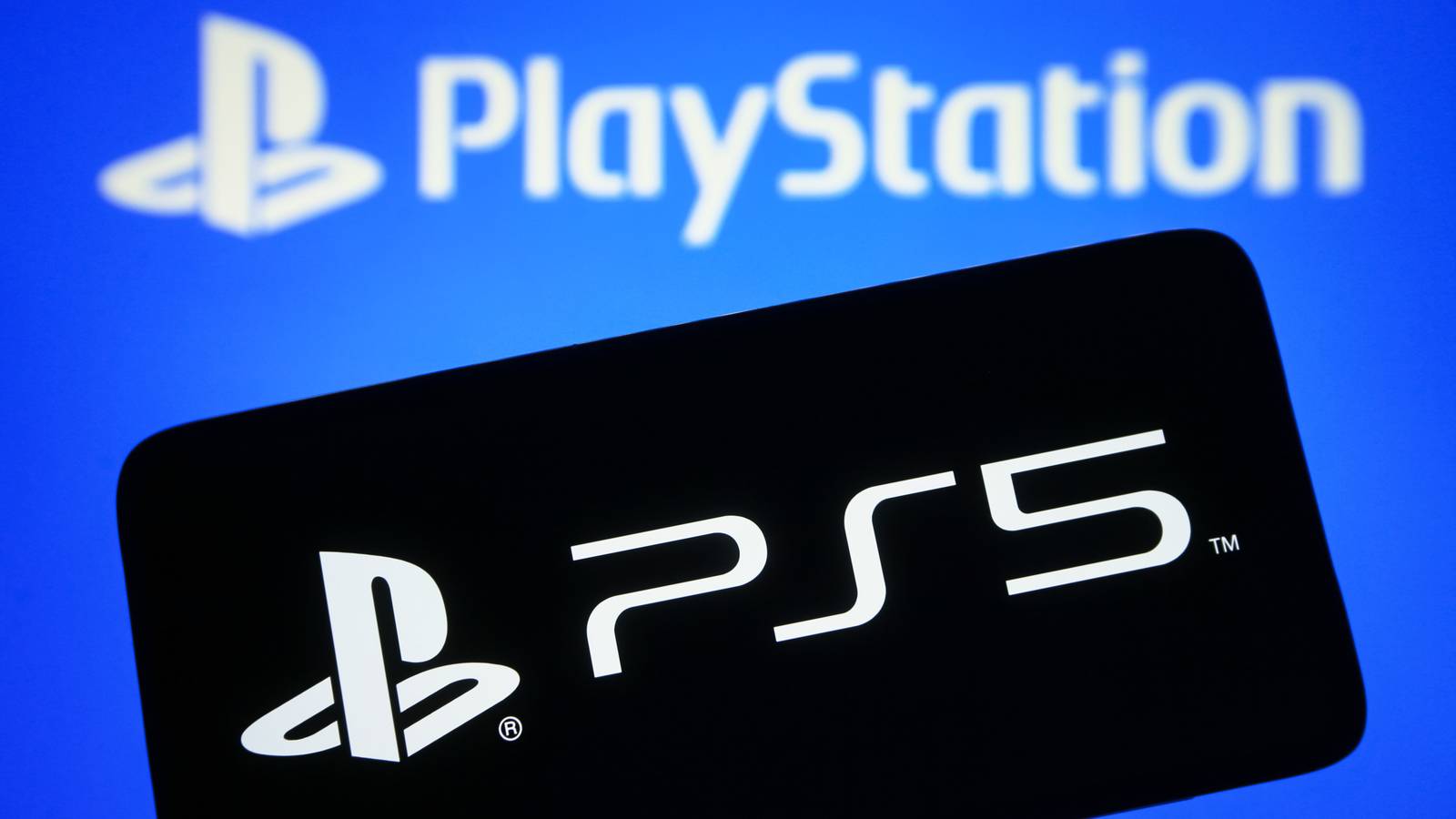 In this photo illustration, PlayStation 5 (PS5) logo is seen on a smartphone screen