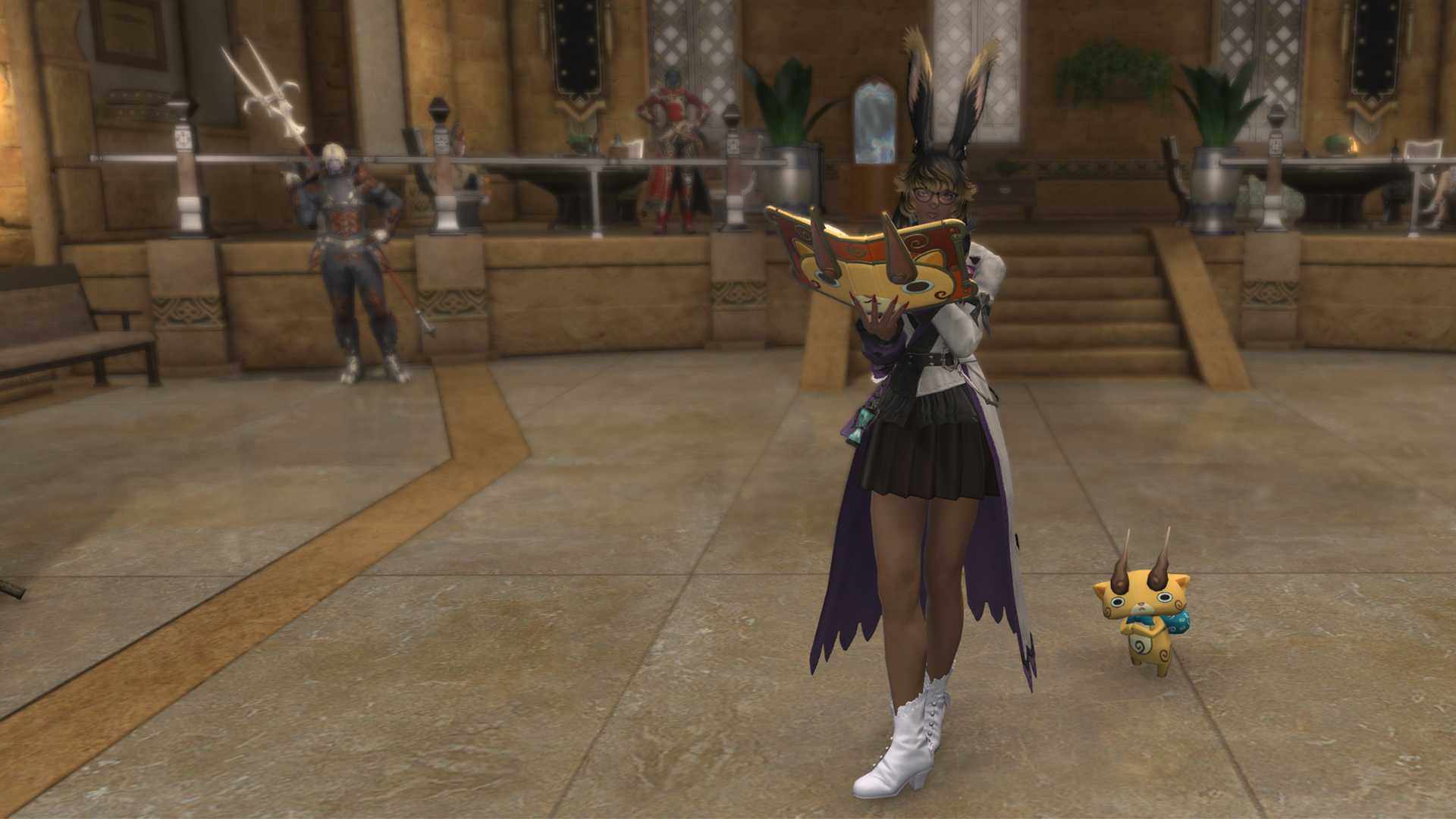 A FFXIV Viera holding a book with an orange cat’s face on it