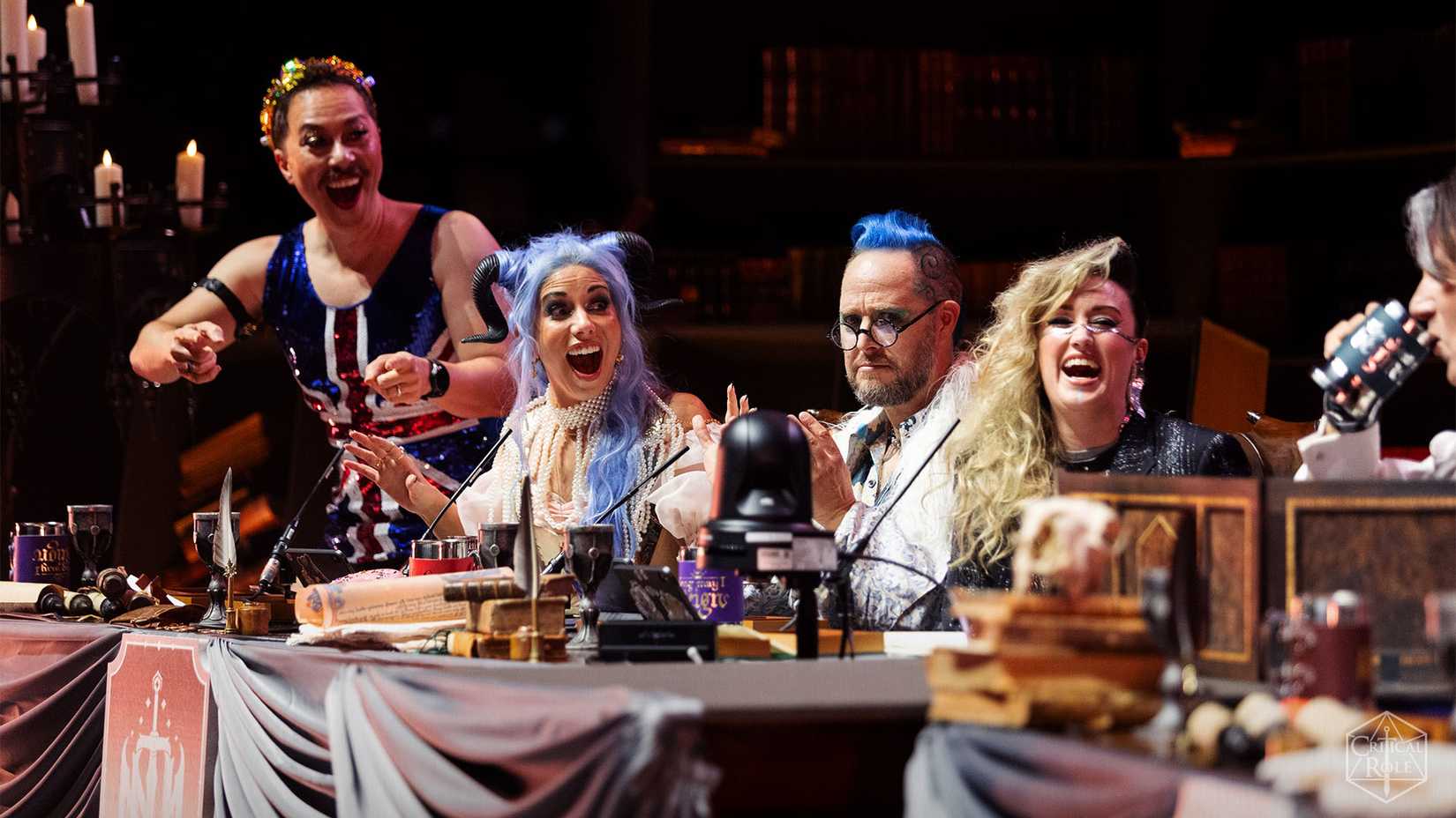 Sam Riegel, Laura Bailey, Taliesin Jaffe, and Ashley Johnson onstage in London wearing theatrical costumes