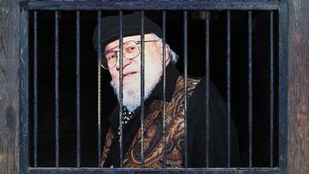 A graphic depicting George R.R. Martin behind bars