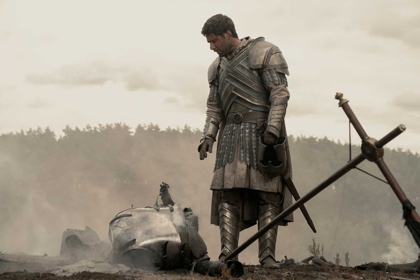 Criston Cole (Fabien Frankel) looks down at a soldier turned to ash on the battlefield