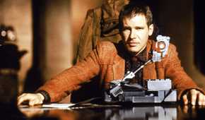 Harrison Ford sitting at a table in Blade Runner