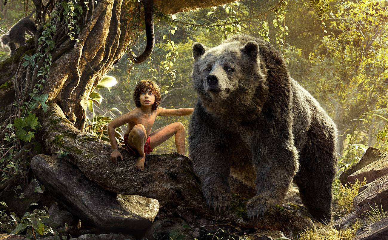 Live-action Mowgli and CG Baloo the bear side-by-side in the jungle