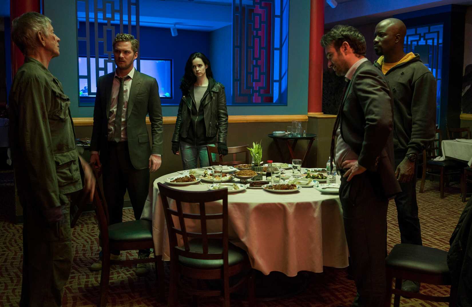 The ensemble cast of The Defenders including Stick, Danny Rand, Jessica Jones, Matt Murdock, and Luke Cage.