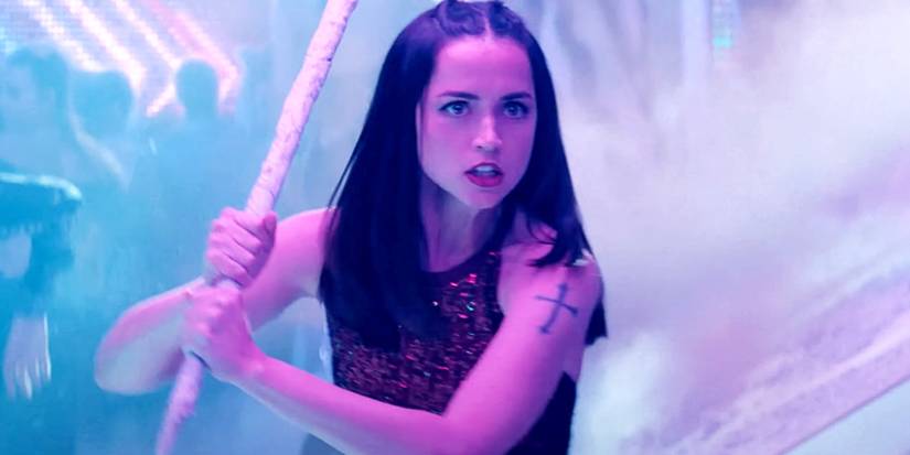 Ana De Armas as Eve Macarro holding a metal pipe in an image from Ballerina